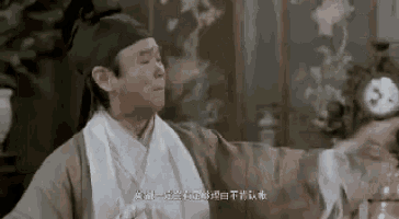 a man in a traditional costume is holding a clock in his hands .