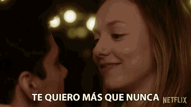 a man and a woman are looking at each other with the words " te quiero mas que nunca " above them