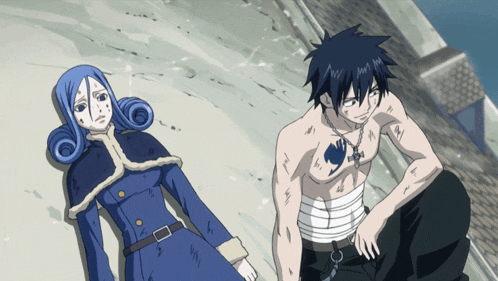 a man and a woman laying on the ground