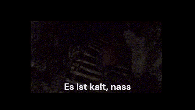 a close up of a person 's chest with the words `` und hart '' written on the bottom .