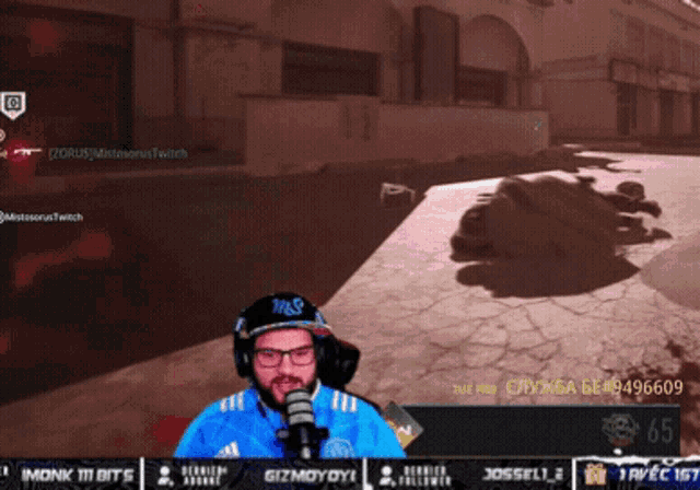 a man wearing glasses and headphones is playing a video game on a computer