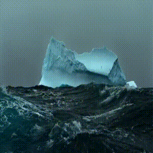 a large iceberg is in the middle of a body of water