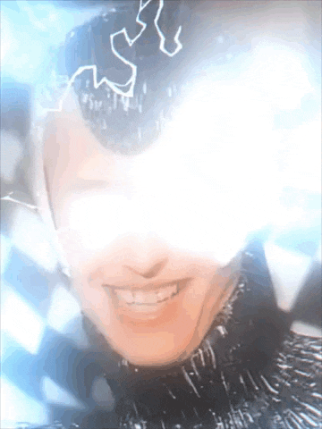 a close up of a person 's face with lightning bolts coming out of their eyes