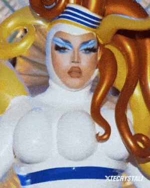 a close up of a person wearing a costume with xtecrystali written below it