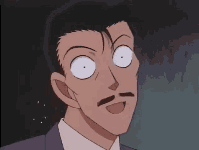 a man with a mustache is making a funny face with his eyes wide open