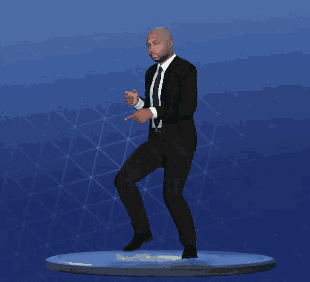 a statue of a man in a suit and tie pointing