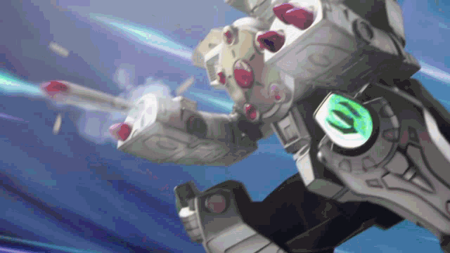 a robot is flying through the air with a green light on the back of it