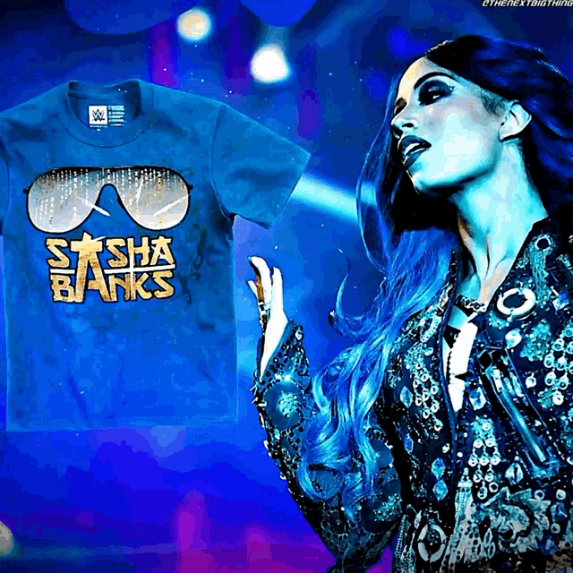 a woman with blue hair is standing next to a sasha banks t-shirt