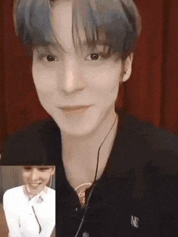 a close up of a person talking on a video call .