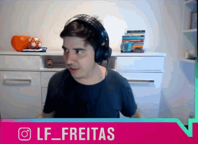 a man wearing headphones with the name freitas on the bottom right
