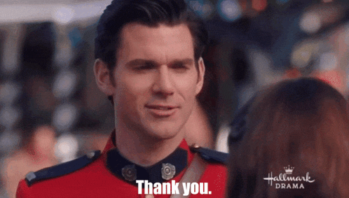 a man in a red uniform says thank you to a woman