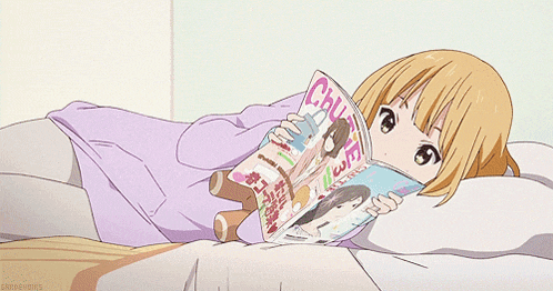 a girl is laying on a bed reading a magazine that says chuve