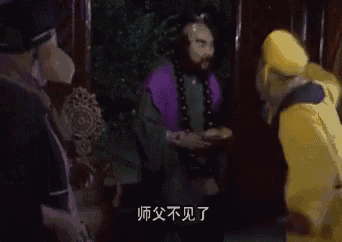 a man in a purple robe is talking to a man in a yellow robe in a room .