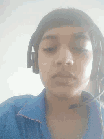 a boy wearing headphones with a microphone on his head