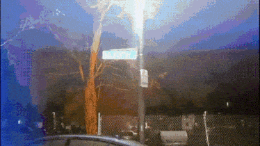 a sign on a pole that says riverside