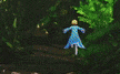a woman in a blue dress is walking through a forest .