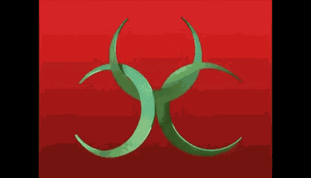 a green crescent moon with a heart in the center on a red background
