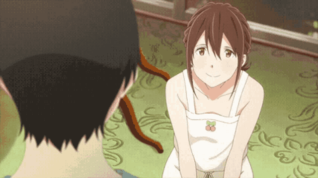 a girl with a cherry on her apron is smiling at a man