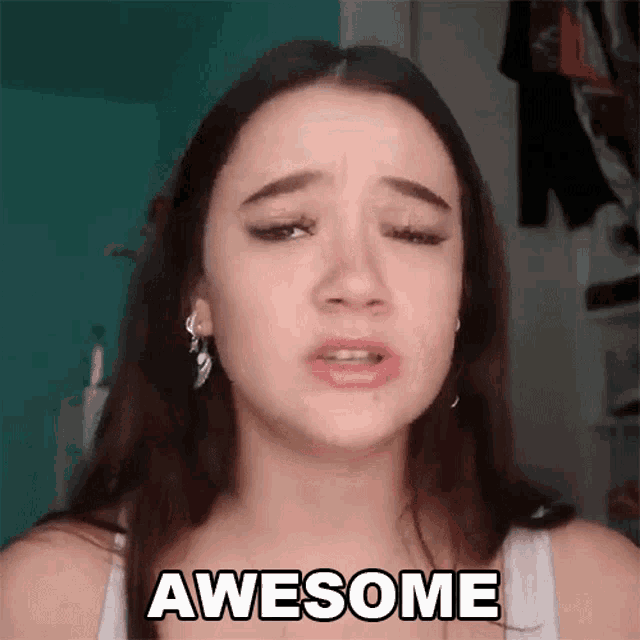 a girl is making a face and says awesome