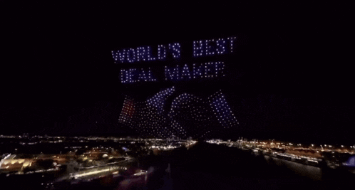 a sign that says world 's best deal maker is displayed in the sky