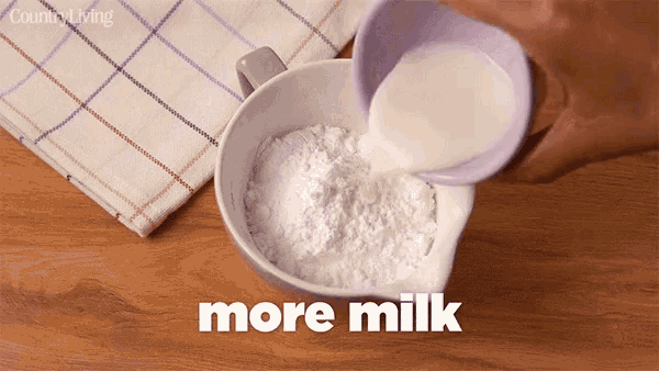 a person pouring milk into a bowl of powdered sugar with the words more milk below it