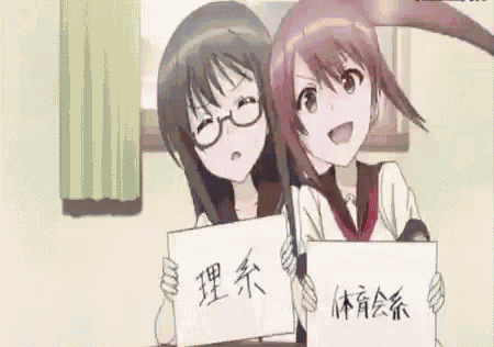 two anime girls are holding up signs with chinese writing