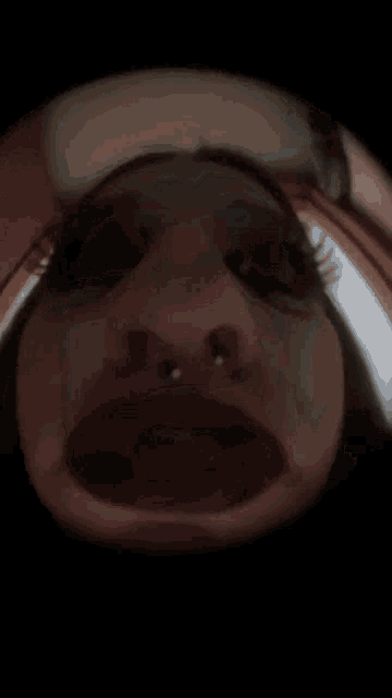 a close up of a person 's face with a beard