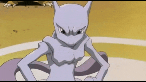 a cartoon character is sitting on a table with his hands on his hips and looking at the camera .