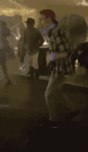 a blurry picture of a man in a floral shirt