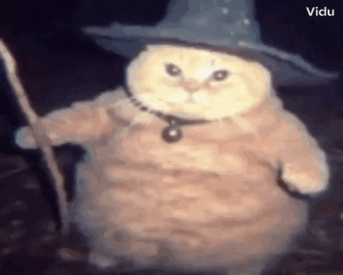 a cat is wearing a wizard costume and holding a wand .