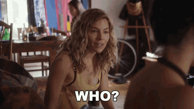 a woman in a yellow tank top is asking the question " who "