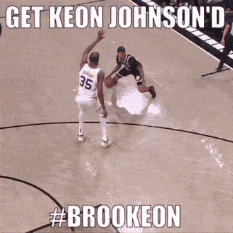 a basketball player wearing a number 35 jersey dribbles the ball