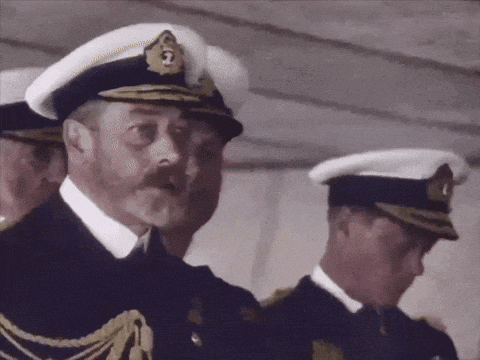 a man in a military uniform has the number 2 on his cap