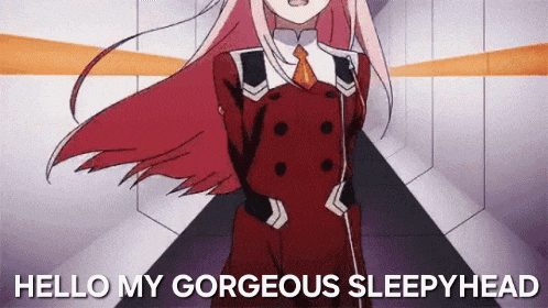a pink haired anime girl is standing in a hallway with the words `` hello my gorgeous sleepyhead '' .