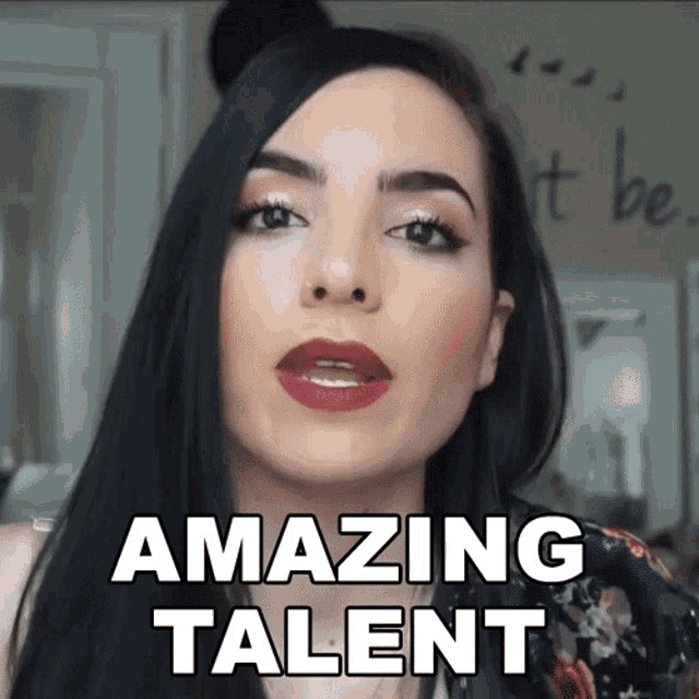 a woman with long black hair and red lips says " amazing talent "