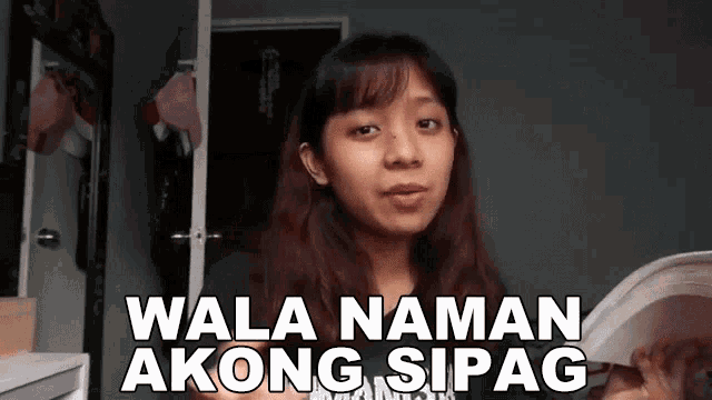 a woman holding a book with the words wala naman akong sipag written above her