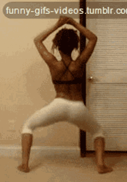 a woman in white pants is dancing in front of a funny-gifs-videos.tumblr.com icon