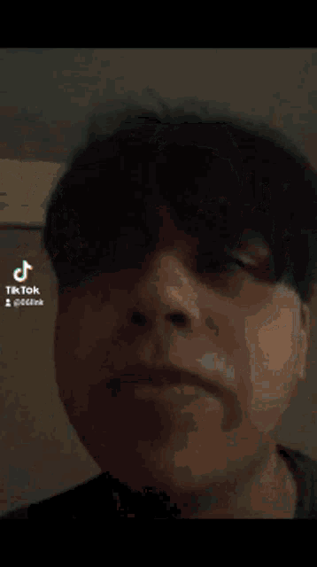 a man wearing a cowboy hat is smiling in a tiktok video ..