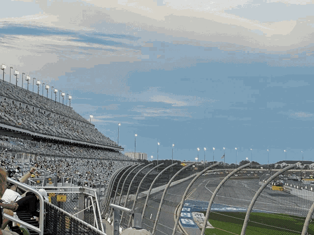 a view of a race track from a stadium with a sign that says ' a ' on it