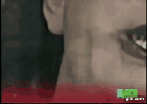 a close up of a man 's neck and mouth with a red border .