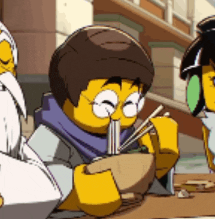 a lego character is eating noodles with chopsticks .