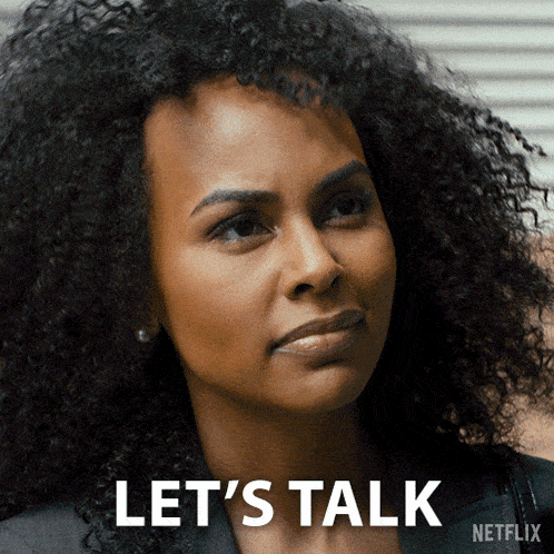 a woman with curly hair says let 's talk in front of a netflix logo