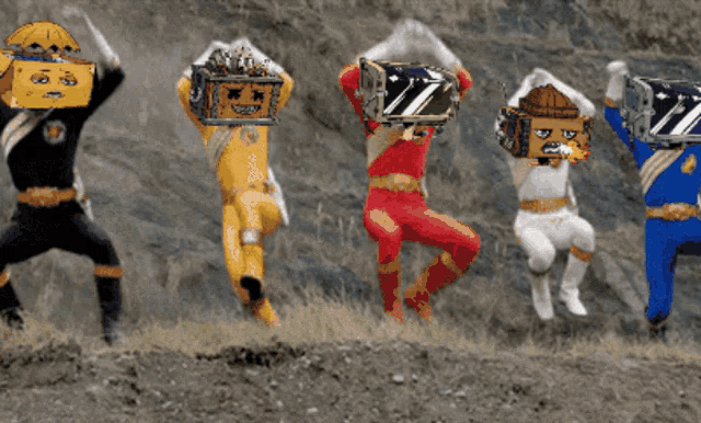 four power rangers carrying boxes on their heads with the letter z on them