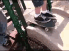 a person is riding a skateboard on a sidewalk .