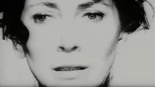 a woman 's face is shown in a black and white photo .