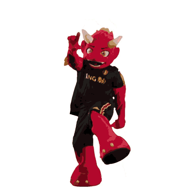 a red mascot is wearing a black shirt that says ag