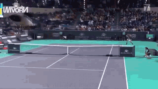 a tennis court with a sign that says muralla