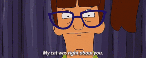 a cartoon character with glasses is saying " my cat was right about you "