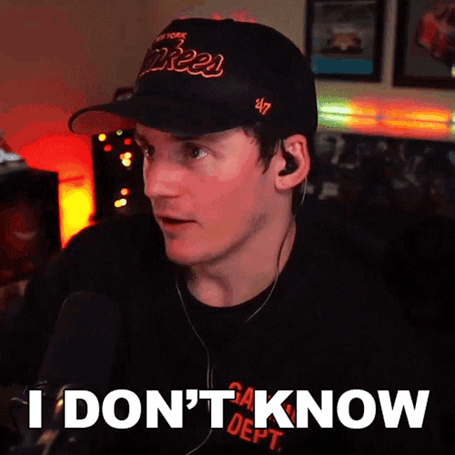 a man wearing a yankees hat says i don t know