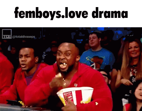 a man in a red jacket is eating popcorn and the caption reads femboys love drama